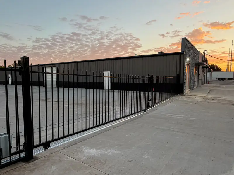 Commercial wrought iron sliding gate at a Fort Worth, TX business lot