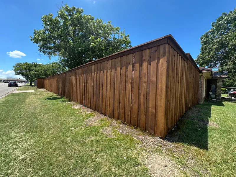 Stained cedar fence project on a DFW residential property