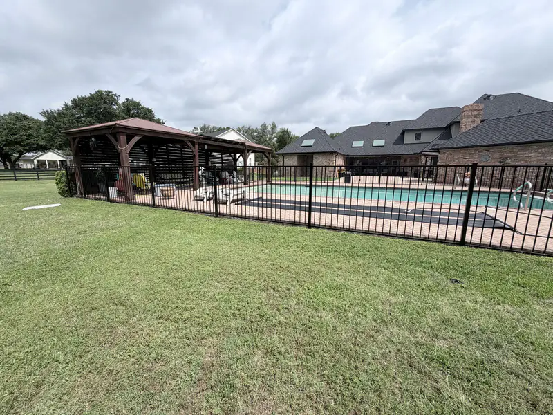 Black wrought iron fence installed in Fort Worth, TX